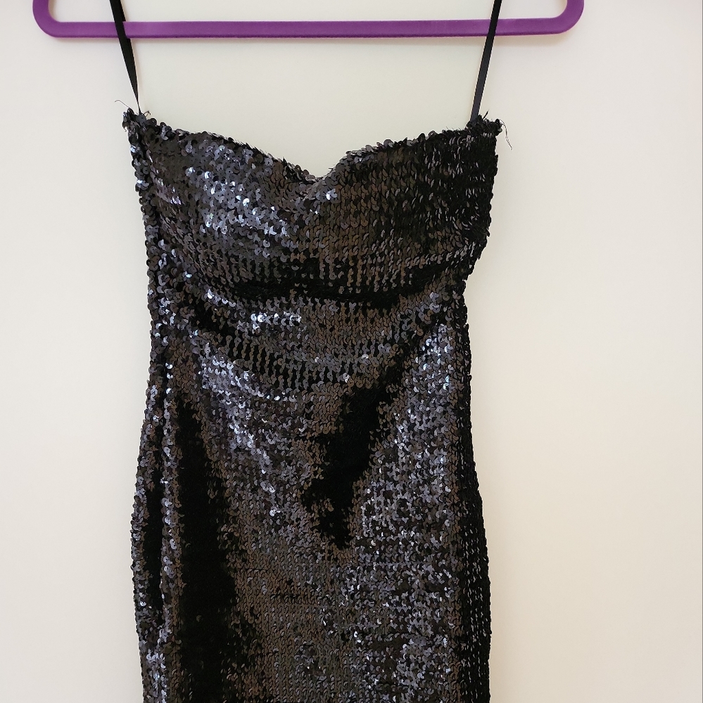 Black Mini sequent dress. Built in straps to easily hang in your closet.